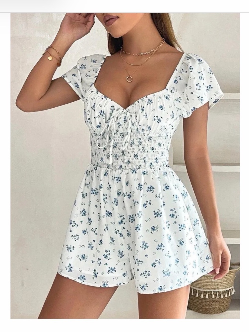 White Floral Smocked Waist Romper. Blue and white, small